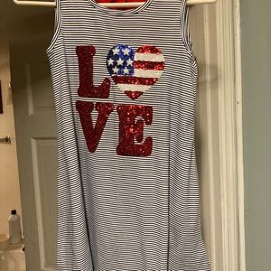 Cotton dress with red tie in back.